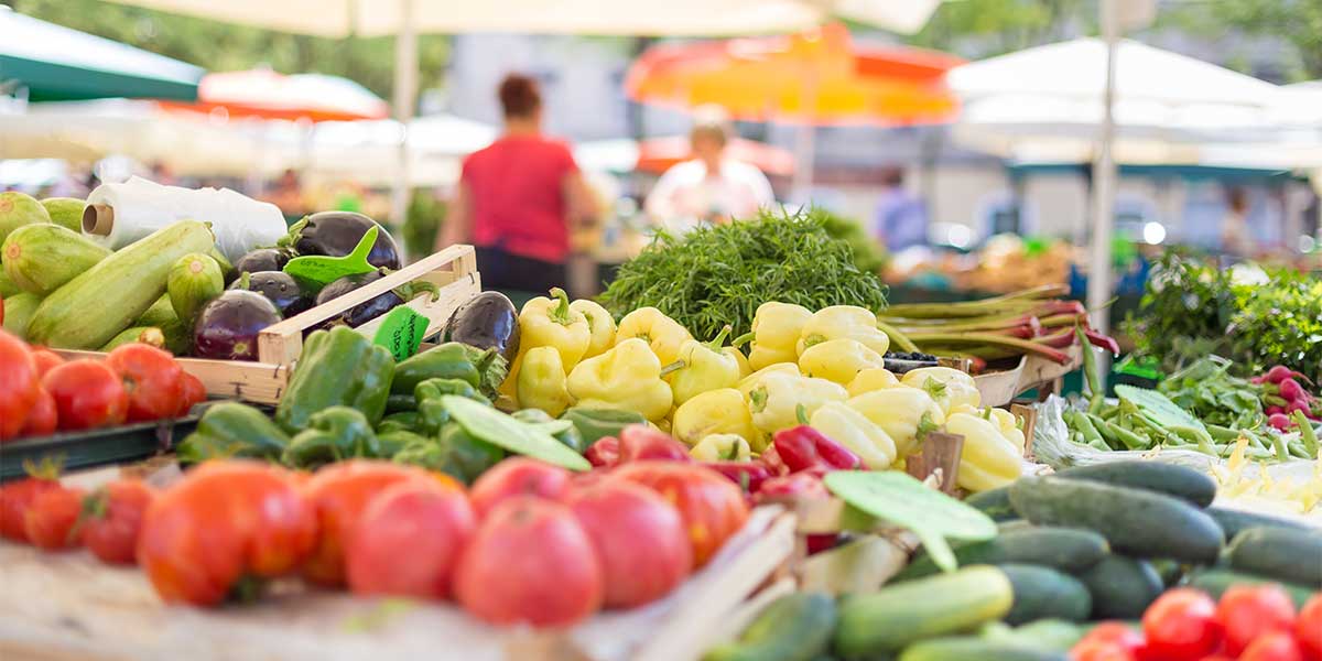 dallas farmers market stall with variety of organic vegetable
