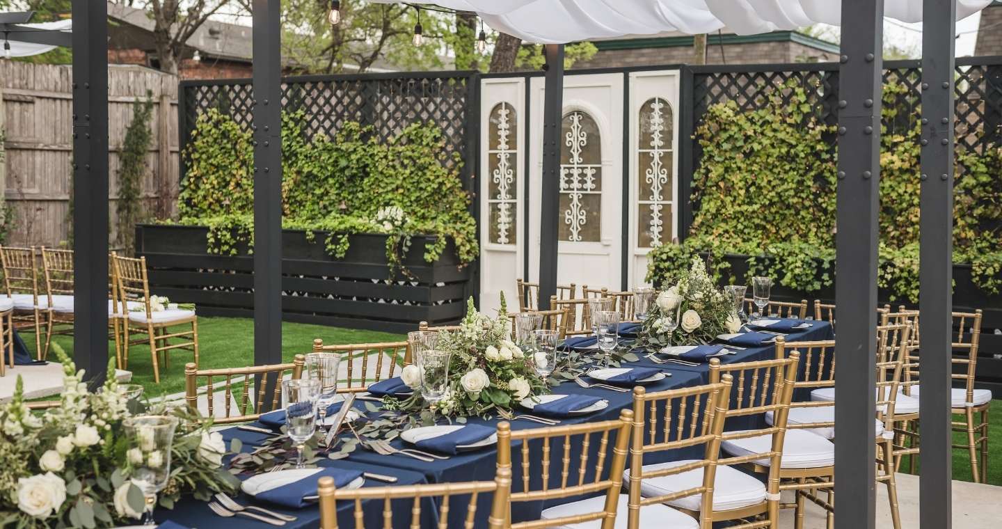 A table set up for a Spring wedding in the gardens of the Gaston ni Dallas, TX