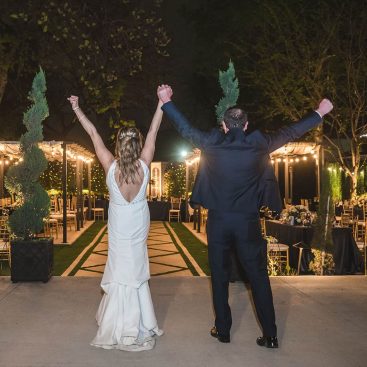 Couple holding hands up in the air